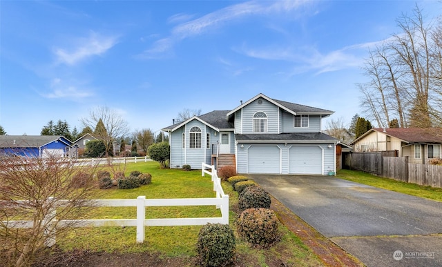 view of front of house with a garage and a front yard