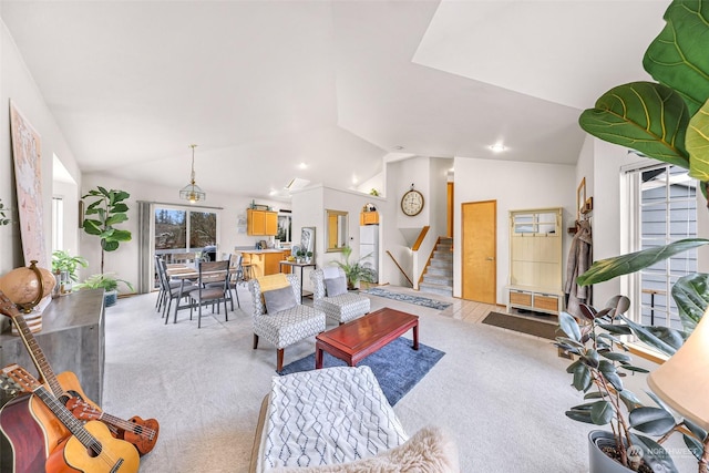 carpeted living room featuring lofted ceiling