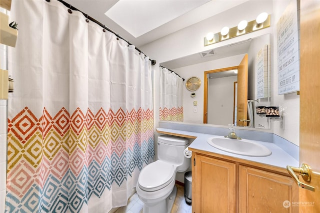 bathroom featuring vanity, a shower with shower curtain, and toilet