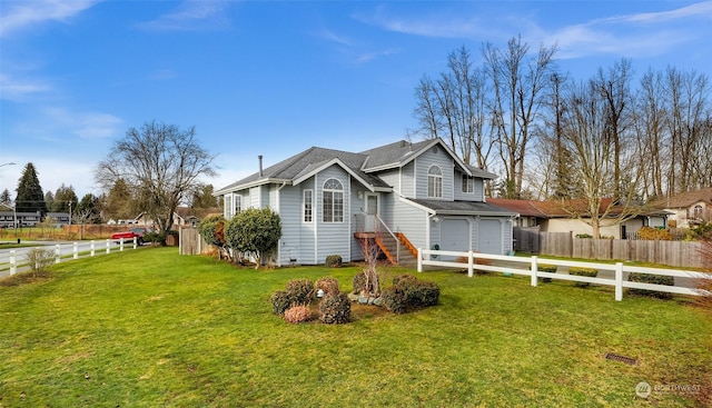 view of front facade with a garage and a front yard