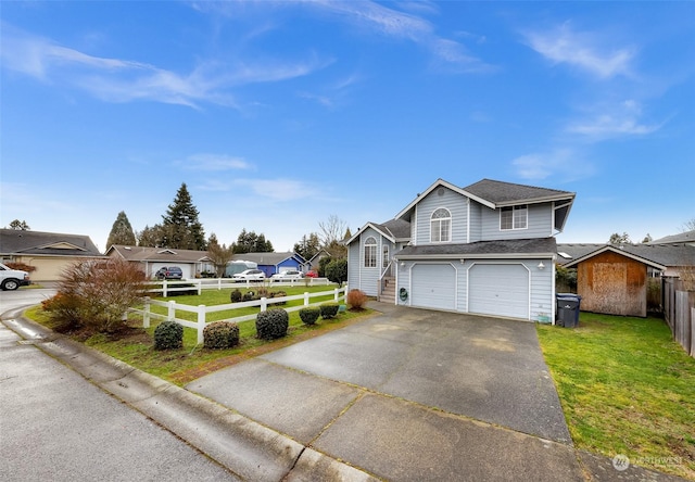 view of front property featuring a garage and a front yard