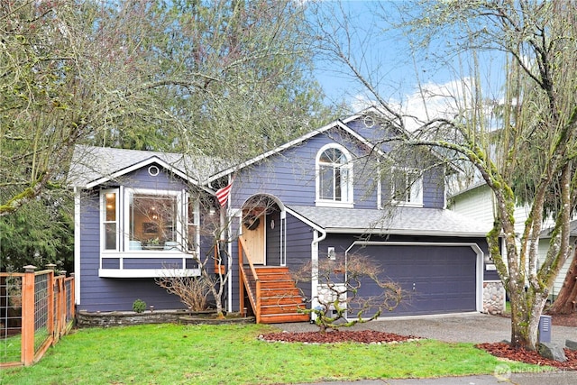 view of front of home featuring a front lawn, fence, roof with shingles, concrete driveway, and a garage