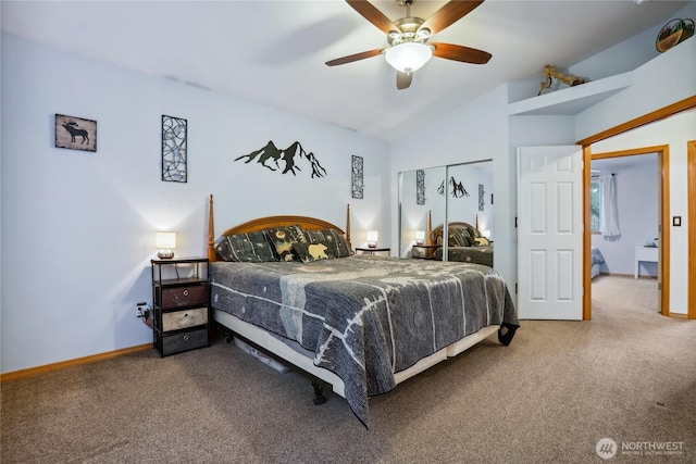 bedroom with lofted ceiling, carpet, and baseboards