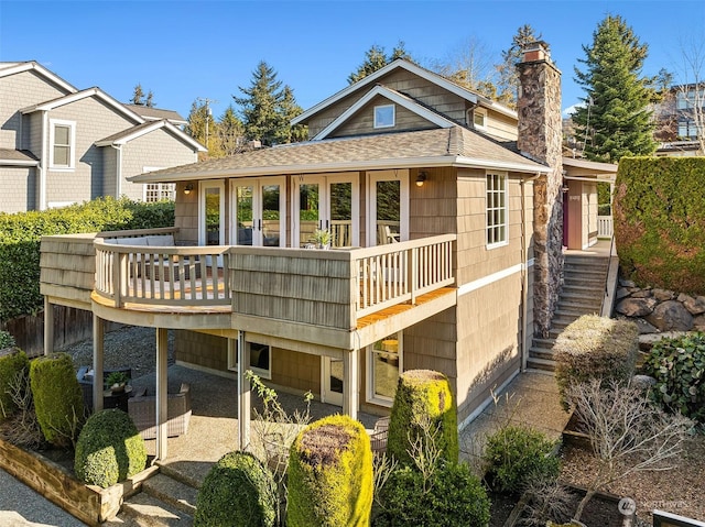 back of property with a balcony