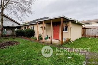 view of front of property with a front lawn