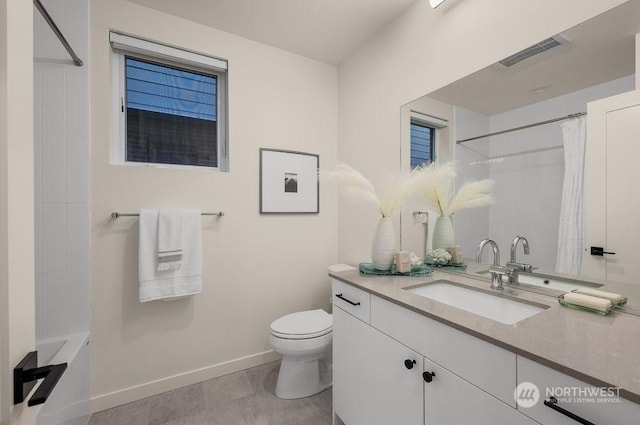 bathroom with vanity, toilet, and curtained shower