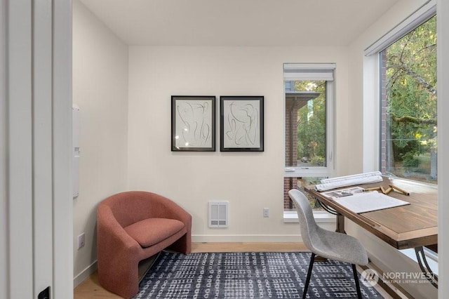 home office featuring hardwood / wood-style floors