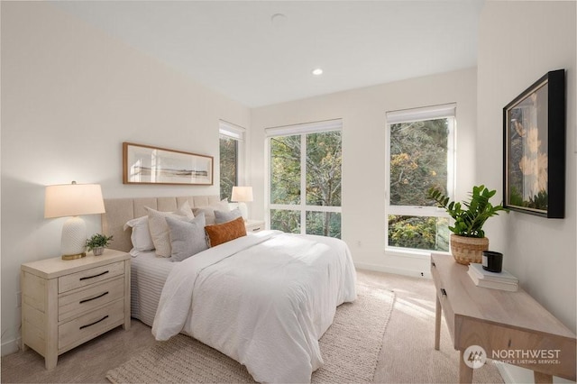 bedroom featuring light colored carpet