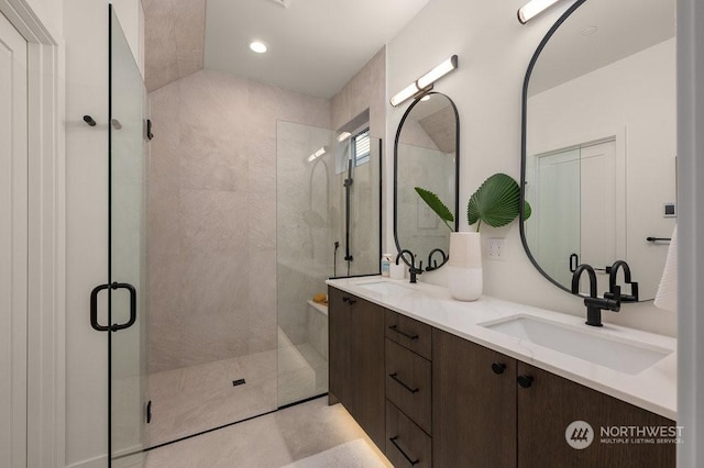 bathroom with vanity and an enclosed shower