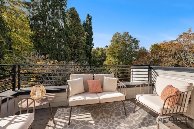 wooden terrace featuring an outdoor hangout area