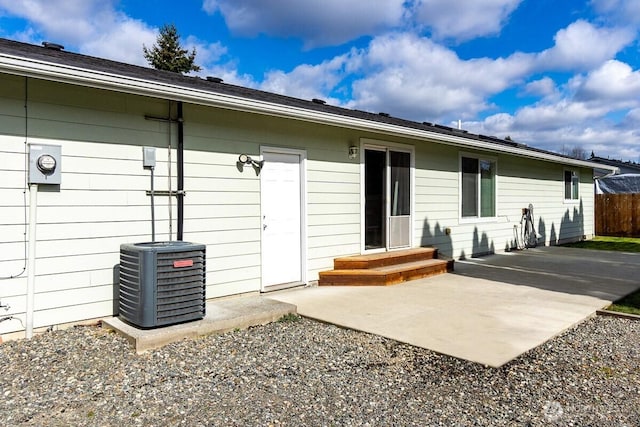 back of house featuring a patio, central AC, and fence