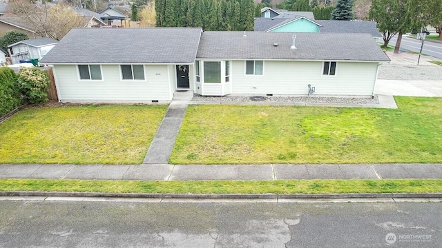 ranch-style home with a shingled roof, a front lawn, and crawl space