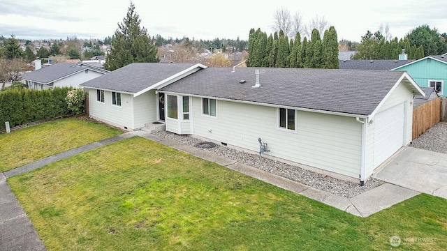 back of house with crawl space, a lawn, fence, and a shingled roof