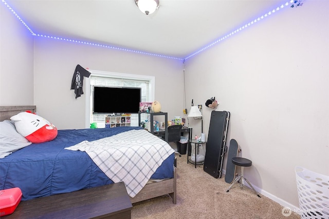 carpeted bedroom with baseboards