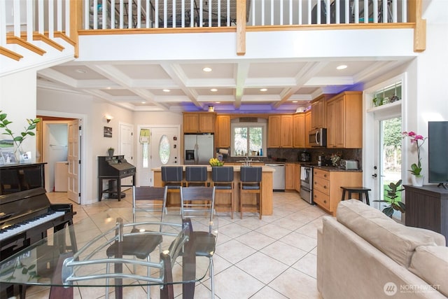 living room with light tile patterned floors, beamed ceiling, coffered ceiling, and recessed lighting