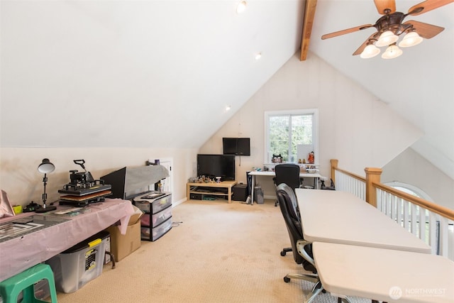 carpeted home office featuring ceiling fan and lofted ceiling with beams