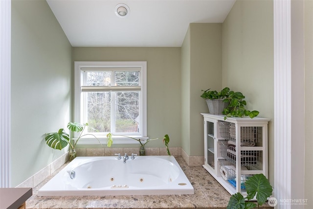 bathroom with a jetted tub