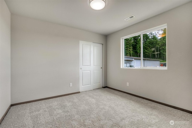 unfurnished room with carpet