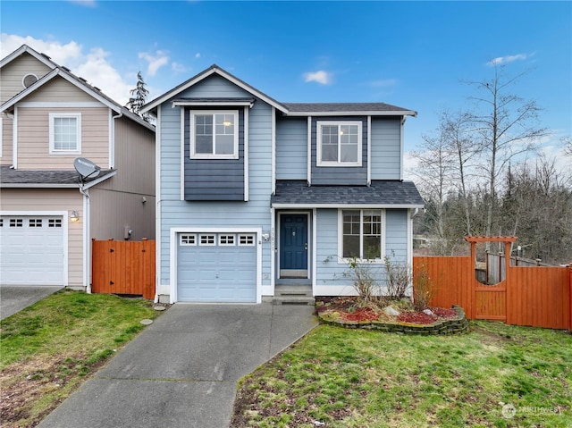 view of front property featuring a garage and a front yard