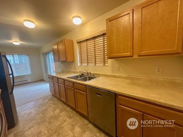 kitchen featuring a baseboard heating unit, dishwasher, sink, and stainless steel fridge