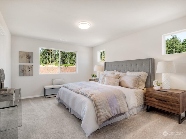 bedroom with light carpet