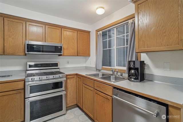 kitchen featuring appliances with stainless steel finishes and sink