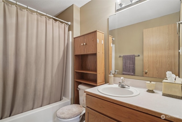 full bathroom featuring vanity, shower / bath combination with curtain, and toilet