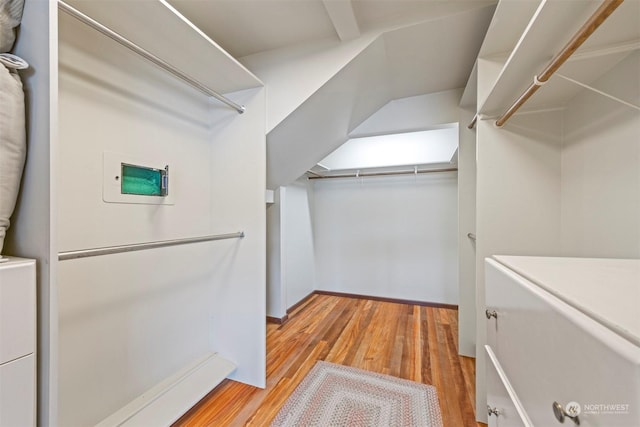 spacious closet with light hardwood / wood-style floors