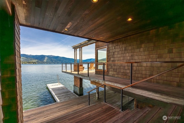 dock area featuring a water and mountain view