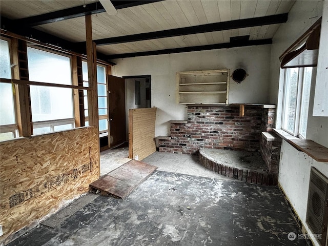 kitchen with beamed ceiling and heating unit