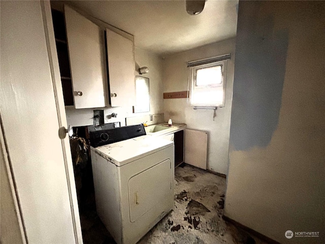 washroom with washer / clothes dryer, sink, and cabinets