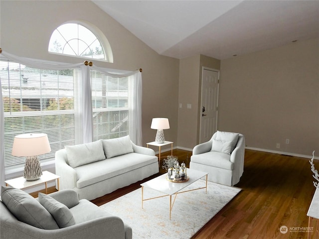 living room with lofted ceiling and dark hardwood / wood-style floors