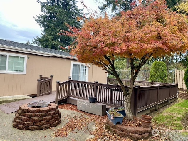 deck featuring an outdoor fire pit