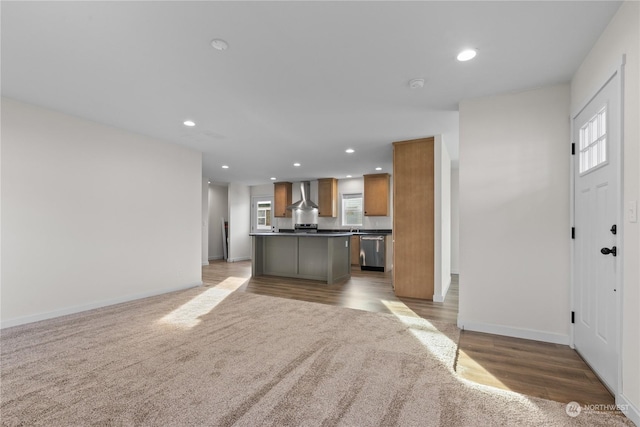 unfurnished living room featuring light colored carpet