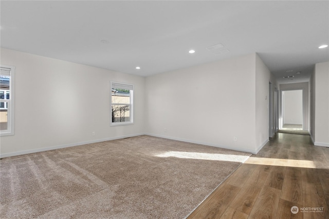 spare room featuring hardwood / wood-style floors