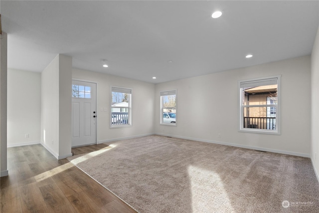 foyer with light hardwood / wood-style floors