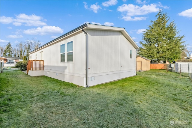 view of side of property with a lawn