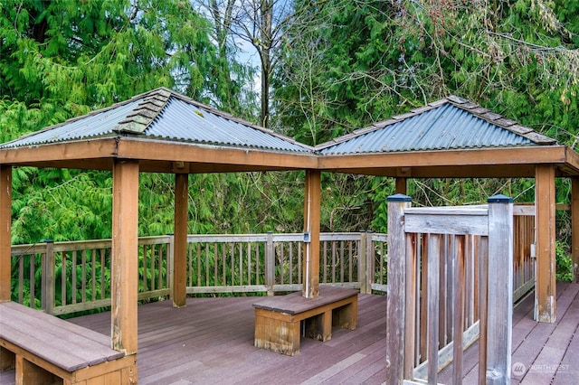 wooden terrace featuring a gazebo