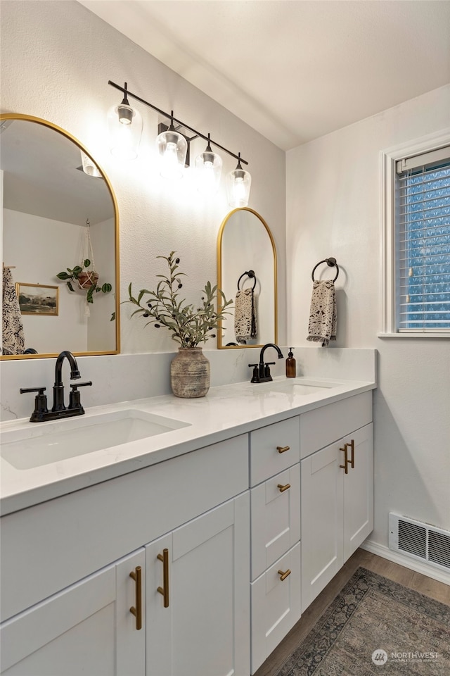 bathroom featuring vanity and hardwood / wood-style floors