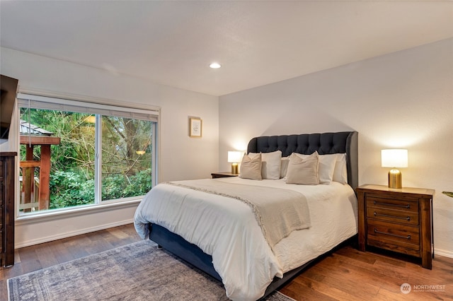 bedroom with hardwood / wood-style flooring