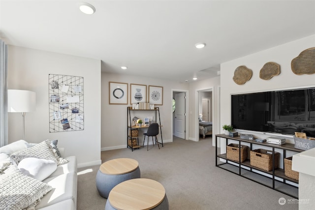 living area featuring recessed lighting, light colored carpet, and baseboards