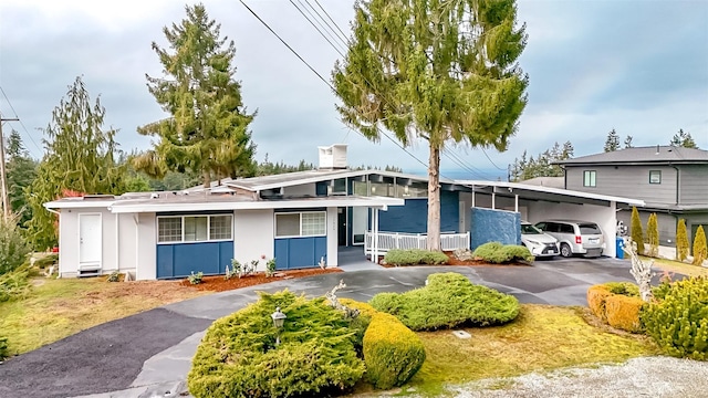 view of front of home with a carport