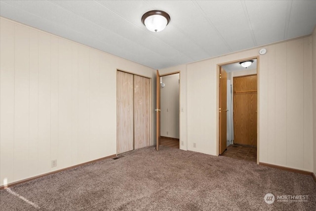 unfurnished bedroom featuring a closet and carpet