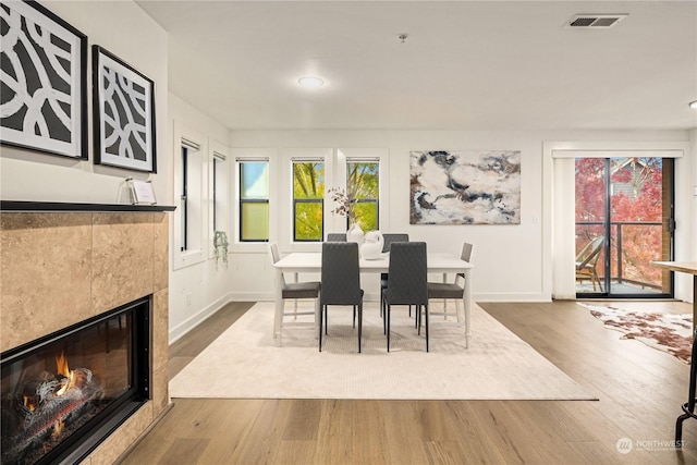 dining area with wood-type flooring