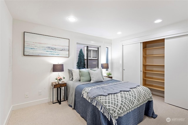 carpeted bedroom featuring a closet