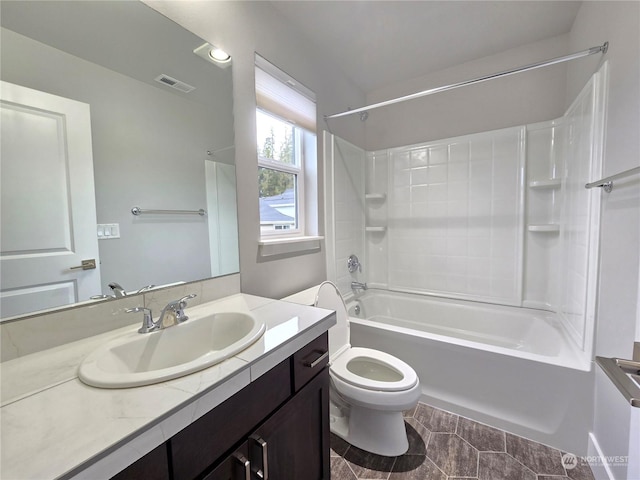 full bathroom featuring shower / tub combination, vanity, and toilet