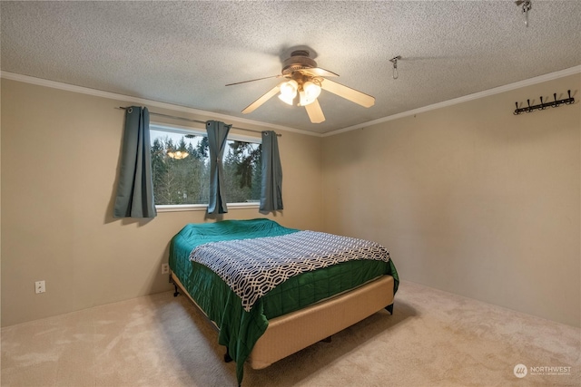 bedroom with ornamental molding, carpet, and a textured ceiling