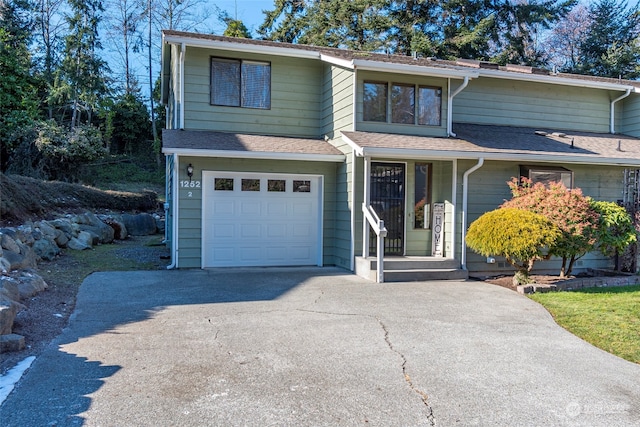 front of property with a garage