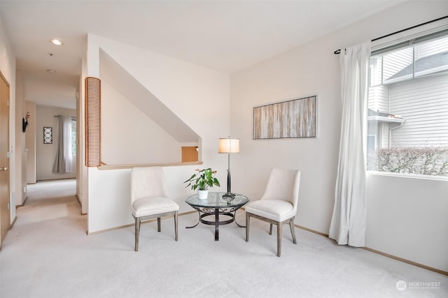 living area featuring recessed lighting, baseboards, and carpet