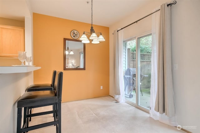 unfurnished dining area featuring a notable chandelier and carpet floors